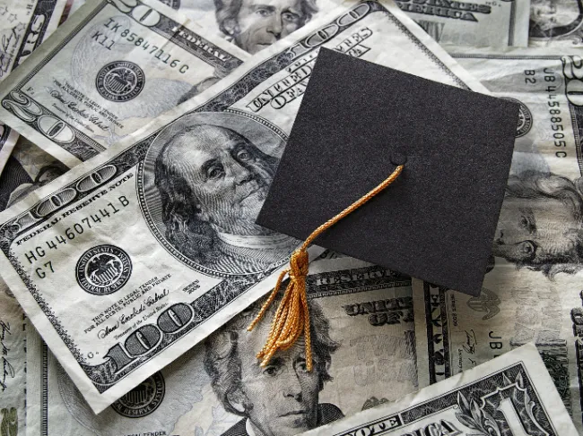 graduation cap with money